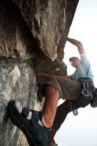 Young Man Rock Climbing
